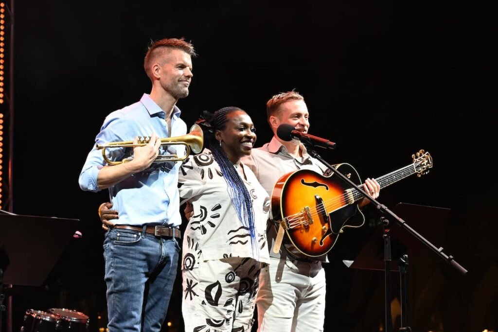 Ade Inubile, Enrick Adam, and Eoin Grace, thanking the crowd after their performance at the Katara Jazz Festival in Doha, Qatar.