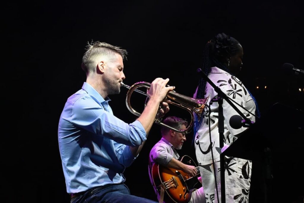 Eoin Grace on trumpet performing live at the Katara Jazz Festival in Doha, Qatar, with Ade and Enrick.